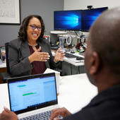 a person talking to a person in an office