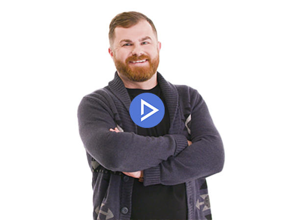 une personne avec une barbe et un cardigan
