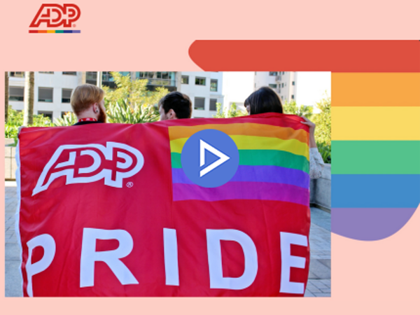 a group of people holding a rainbow flag