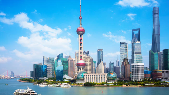 a city skyline with a boat on the water