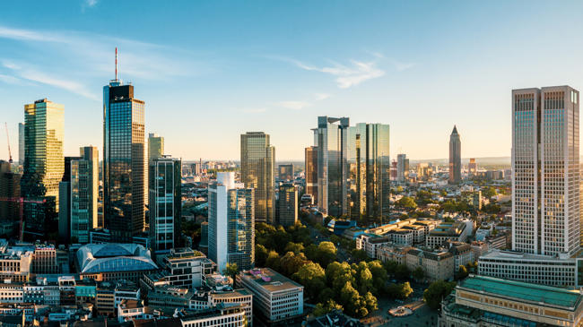 a city with tall buildings and trees