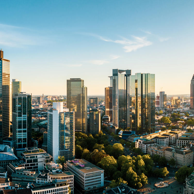 a city with tall buildings and trees