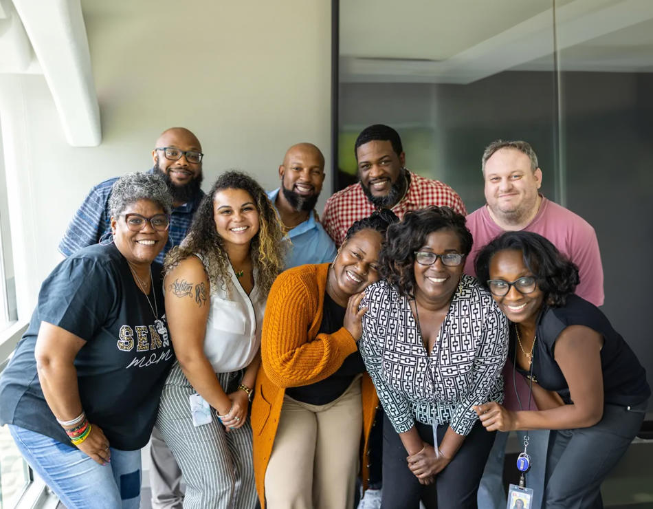 a group of people posing for a photo